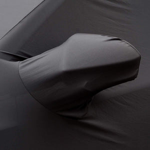 Fleece-lined interior of an indoor car cover showing soft paintwork protection layer