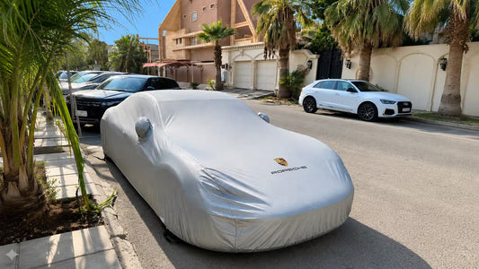 best car cover Australia fitted silver outdoor cover on sedan in suburban driveway